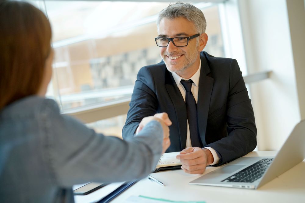 Bank lender shaking hands with a client